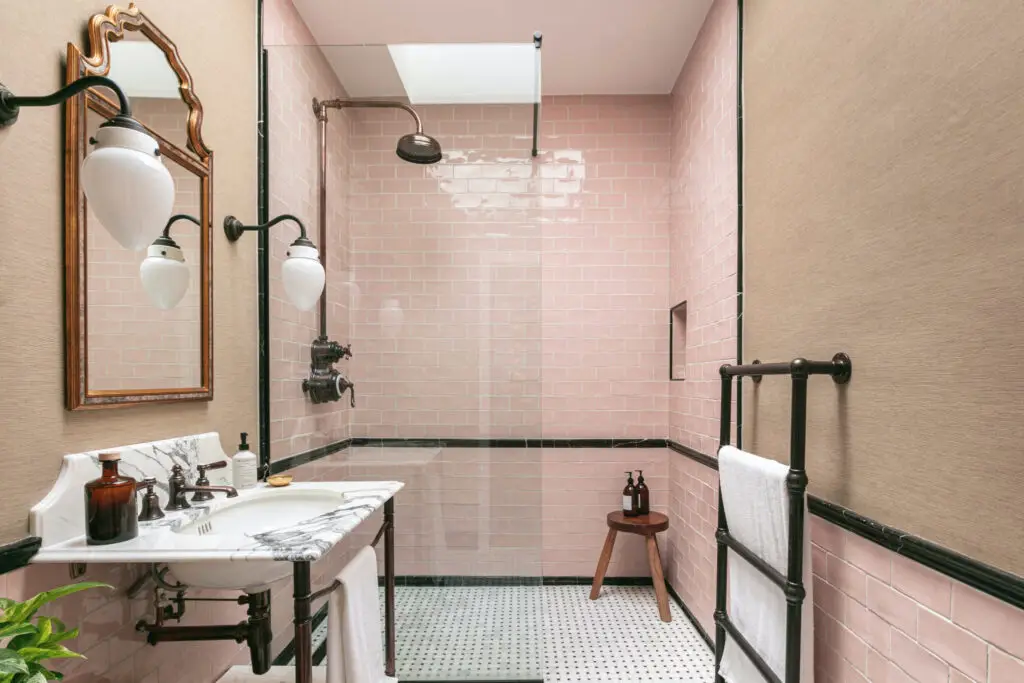 Professional heated towel rail installation in modern bathroom